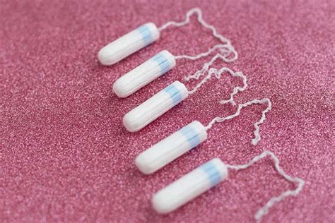 how much string should be left out of a tampon|How much of the tampon string is supposed to be left hanging。